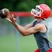 A Whitmore Lake football player reaches out to catch a long pass during practice at the school on Tuesday, August 13, 2013. Melanie Maxwell | AnnArbor.com